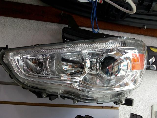 Farol ASX Lado Esq. (Genuíno Mitsubishi)