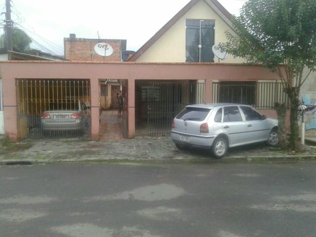 Vendo terreno com 4 casas