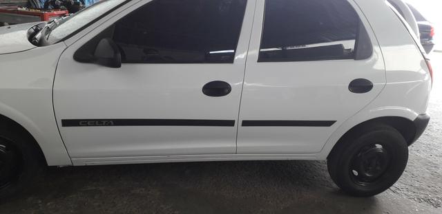 Celta 2005 Branco 4p Ar Vidro Trava Pneus - Foto 3
