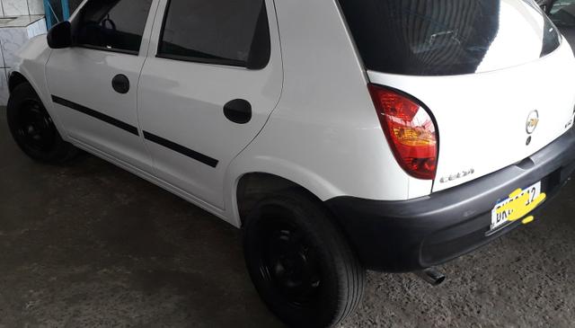 Celta 2005 Branco 4p Ar Vidro Trava Pneus - Foto 4