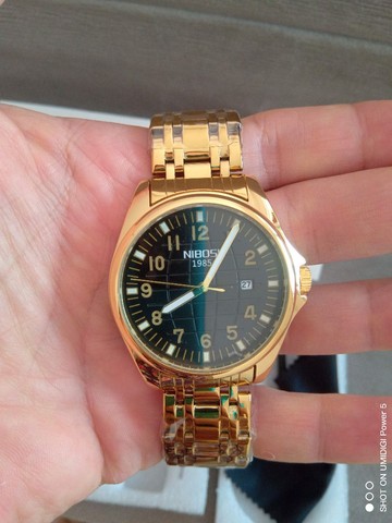 Relógio original importado Marca Nibosi em aço inox Gold frete incluso.