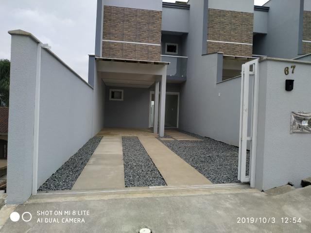 Sobrado geminado com 107 m² no Bairro Iririu