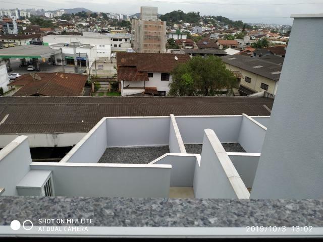 Sobrado geminado com 107 m² no Bairro Iririu - Foto 14