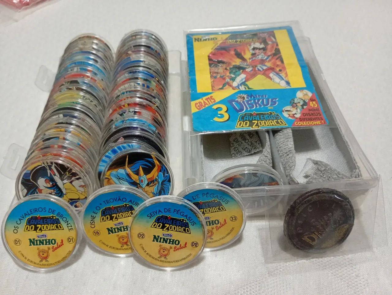 COLEÇÃO COMPLETA CAVALEIROS DO ZODÍACO MINI DISKUS TAZOS NINHO