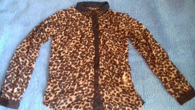 Camisa oncinha animal print marisa