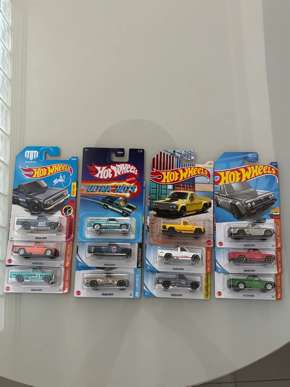 Hot Wheels Mazda Repu (lote 12 miniaturas com protetor de blister)