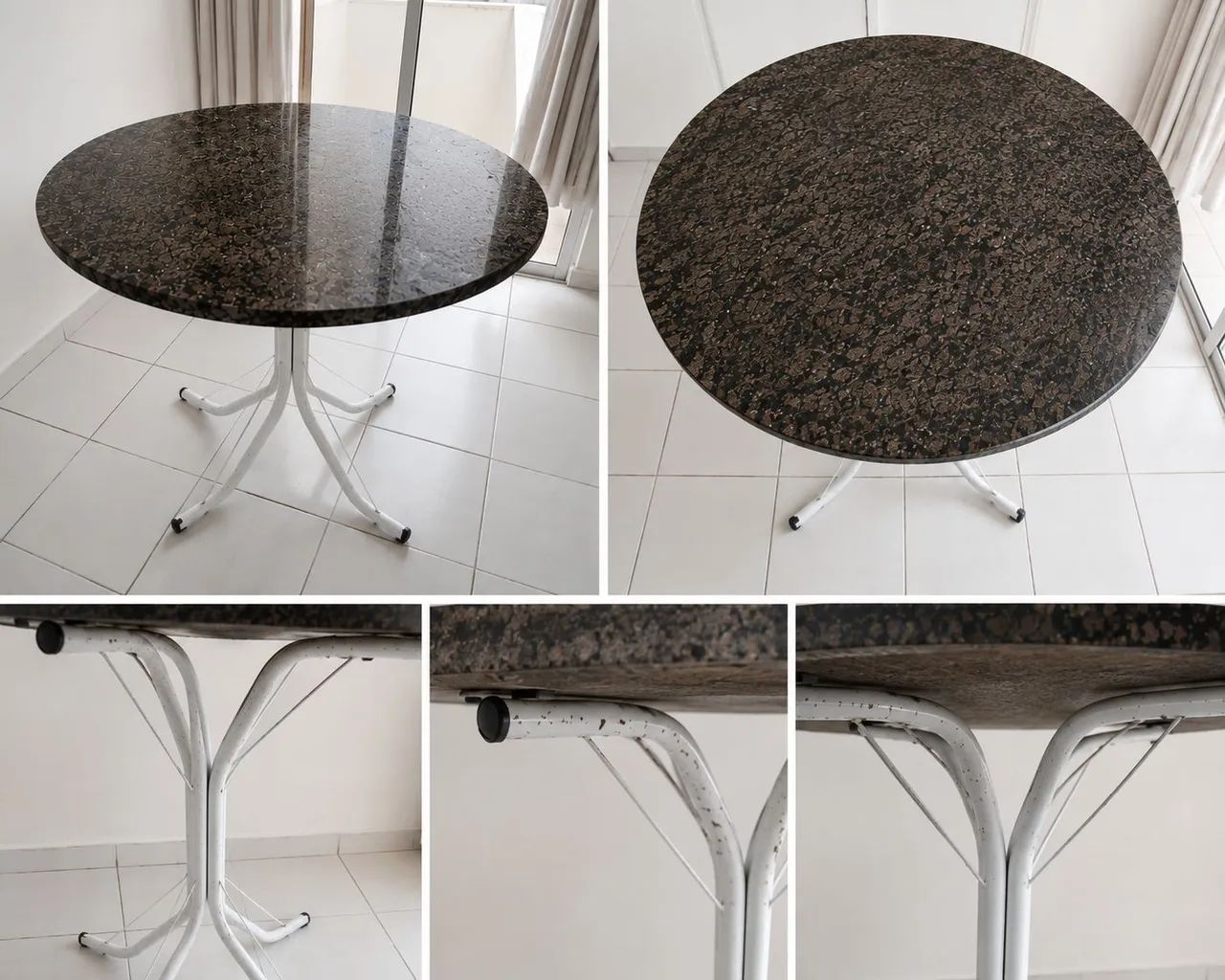 Mesa redonda com tampo de granito, resistente e de fácil limpeza.