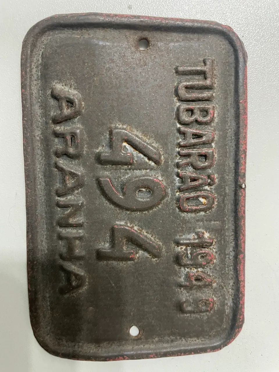Placa de carros de boi e aranha