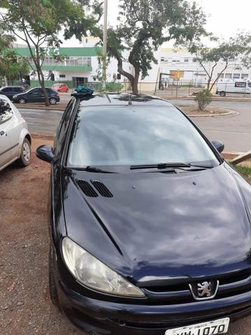 Peugeot em dias vendo ou troco por moto - Foto 2