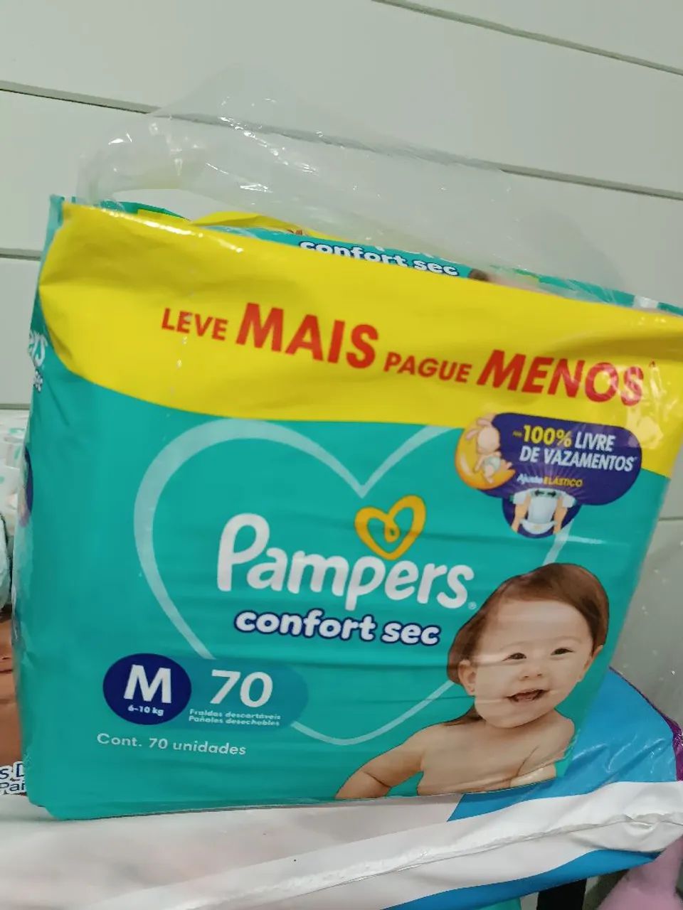 Fralda Pampers M e G