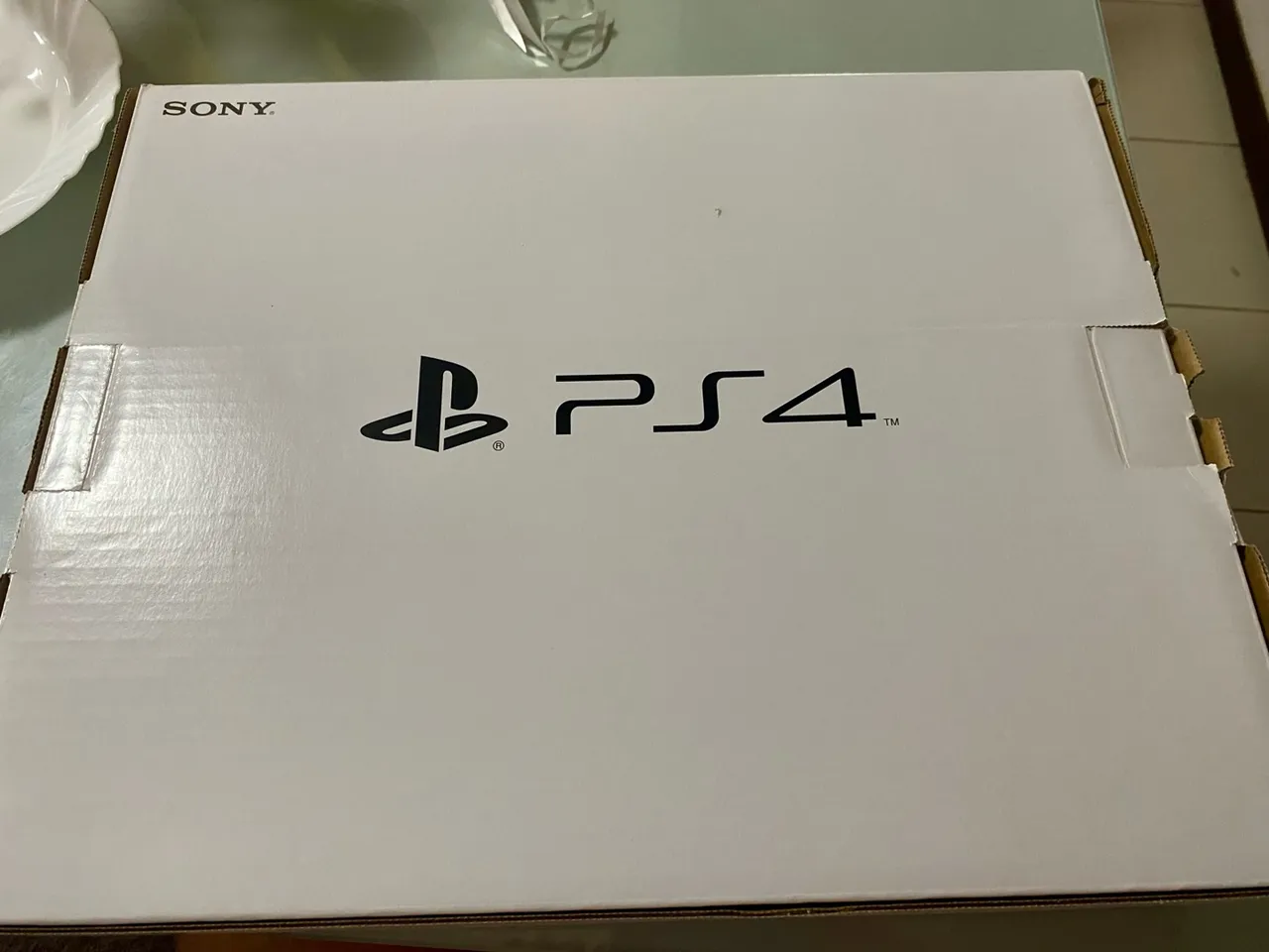 PlayStation 4 (PS4) - Em bom estado na Caixa