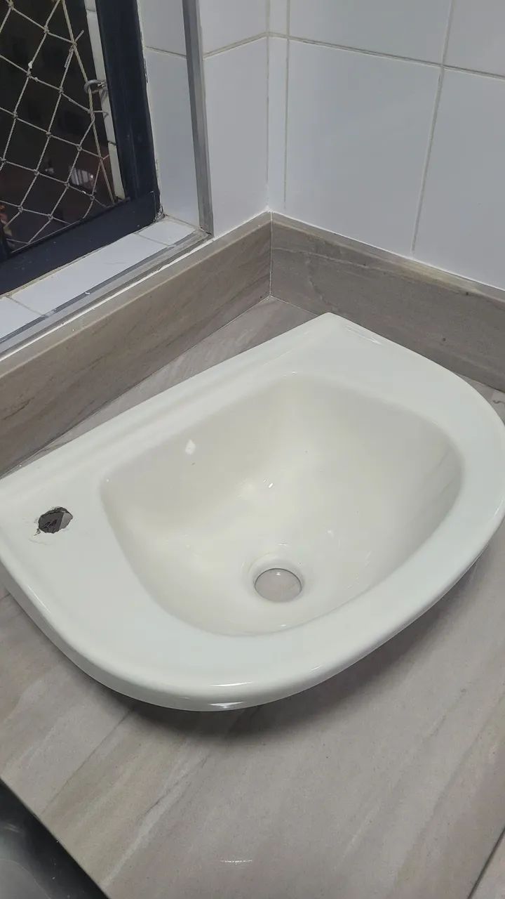 Ceramic bathroom sink with faucet