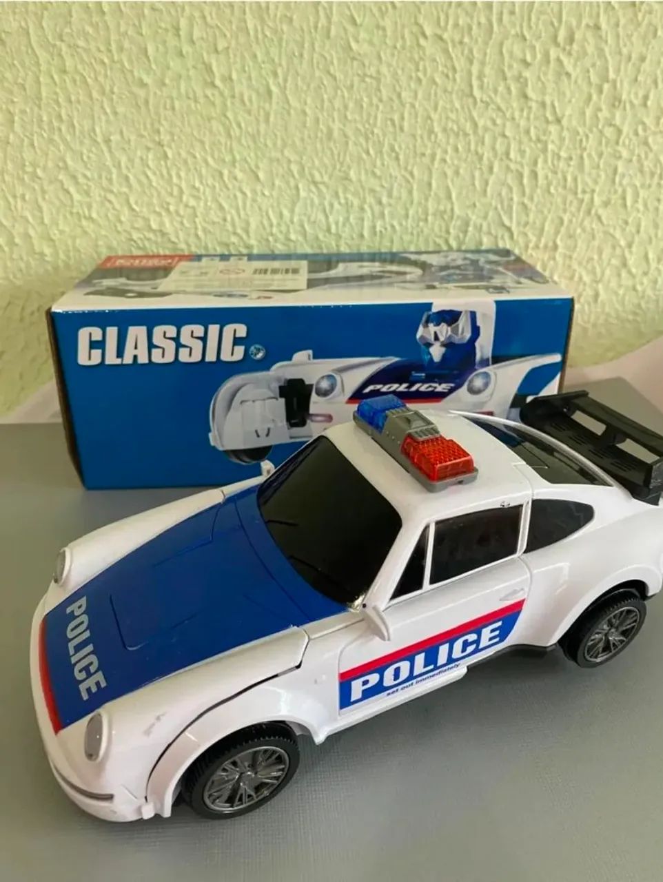 Carro Polícia Transformer Musical e Bate Volta