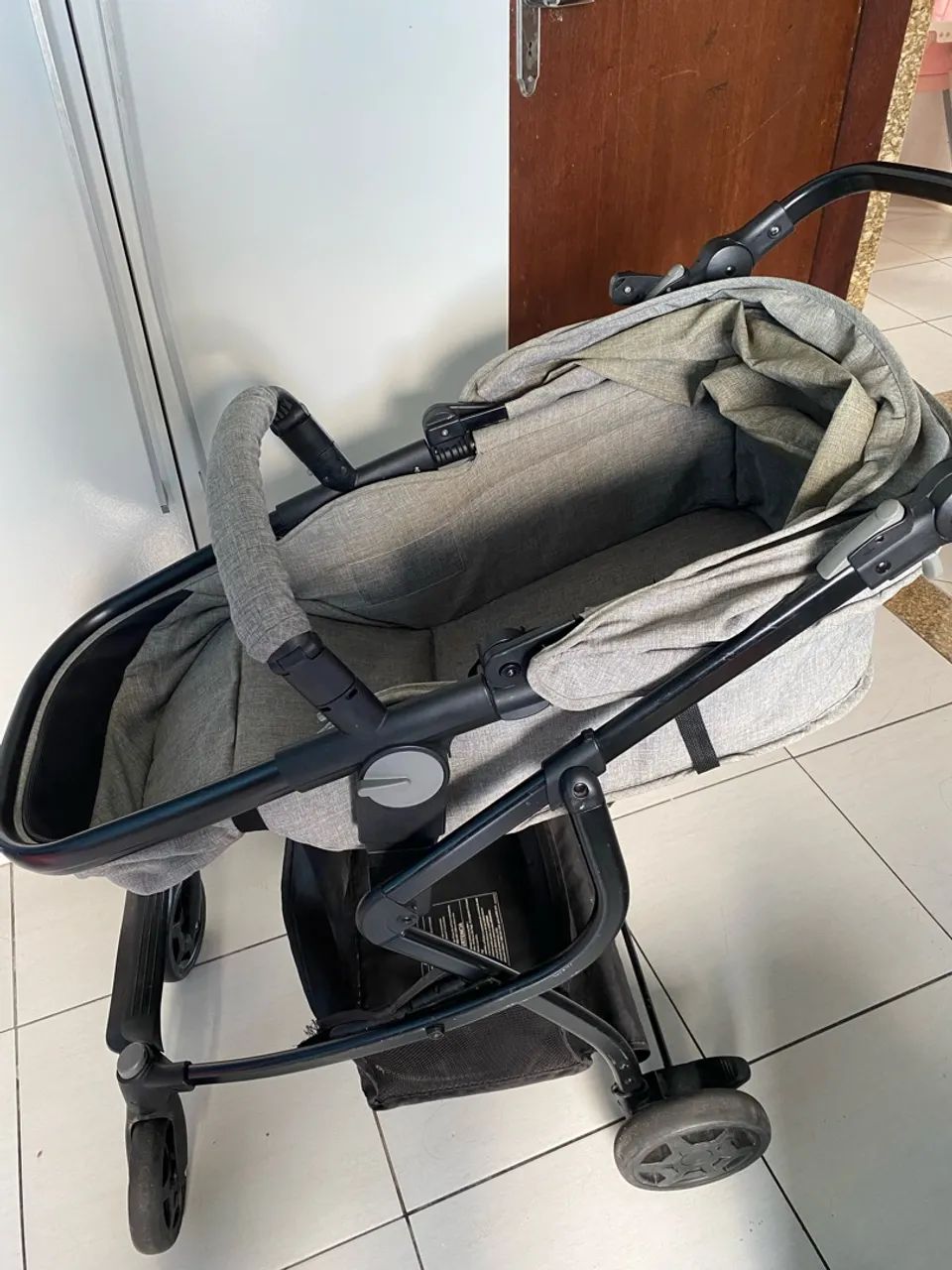 Carrinho com bebê conforto 