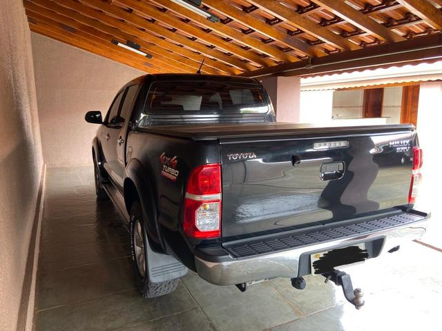 Hilux srv 2013/2013 preta diesel 85.100 km impecável sem detalhes 4 pneus bfgoodrich zero - Foto 5