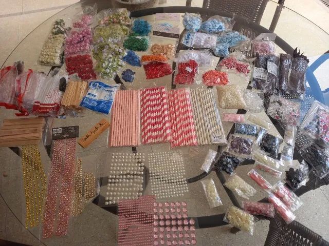 Assortment of trimmings (ribbons, paper straws, bows, zippers, and others)