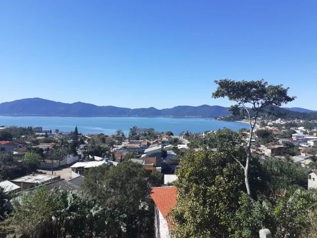VENDO Terreno em frente a BR 101, ao lados moradores antigos, restaurante e posto gasolina