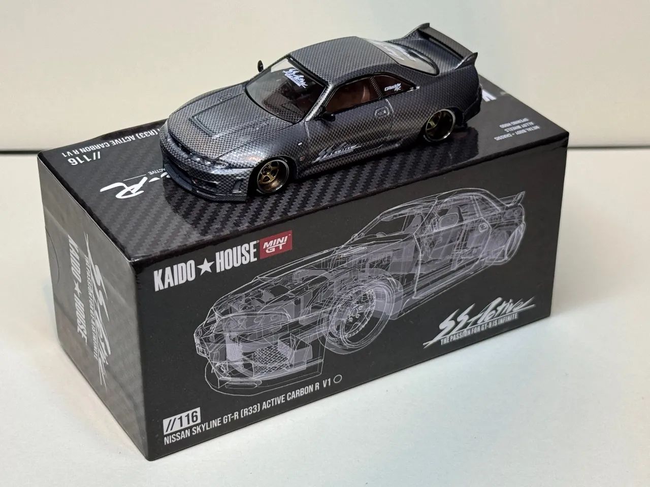 Kaido House Nissan Skyline GT-R (R33) Carbon CHASE - Brinquedos e