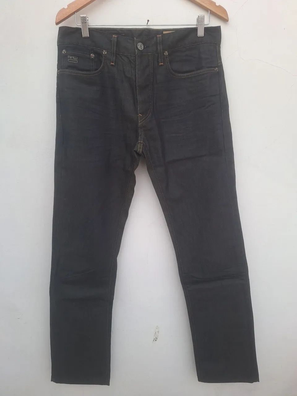 calça jeans resinada g-star raw