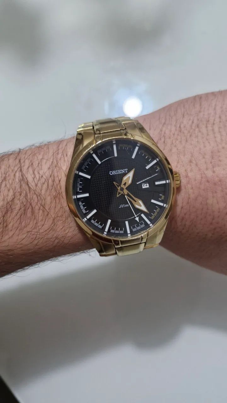 Relógio ORIENT dourado original banhado.