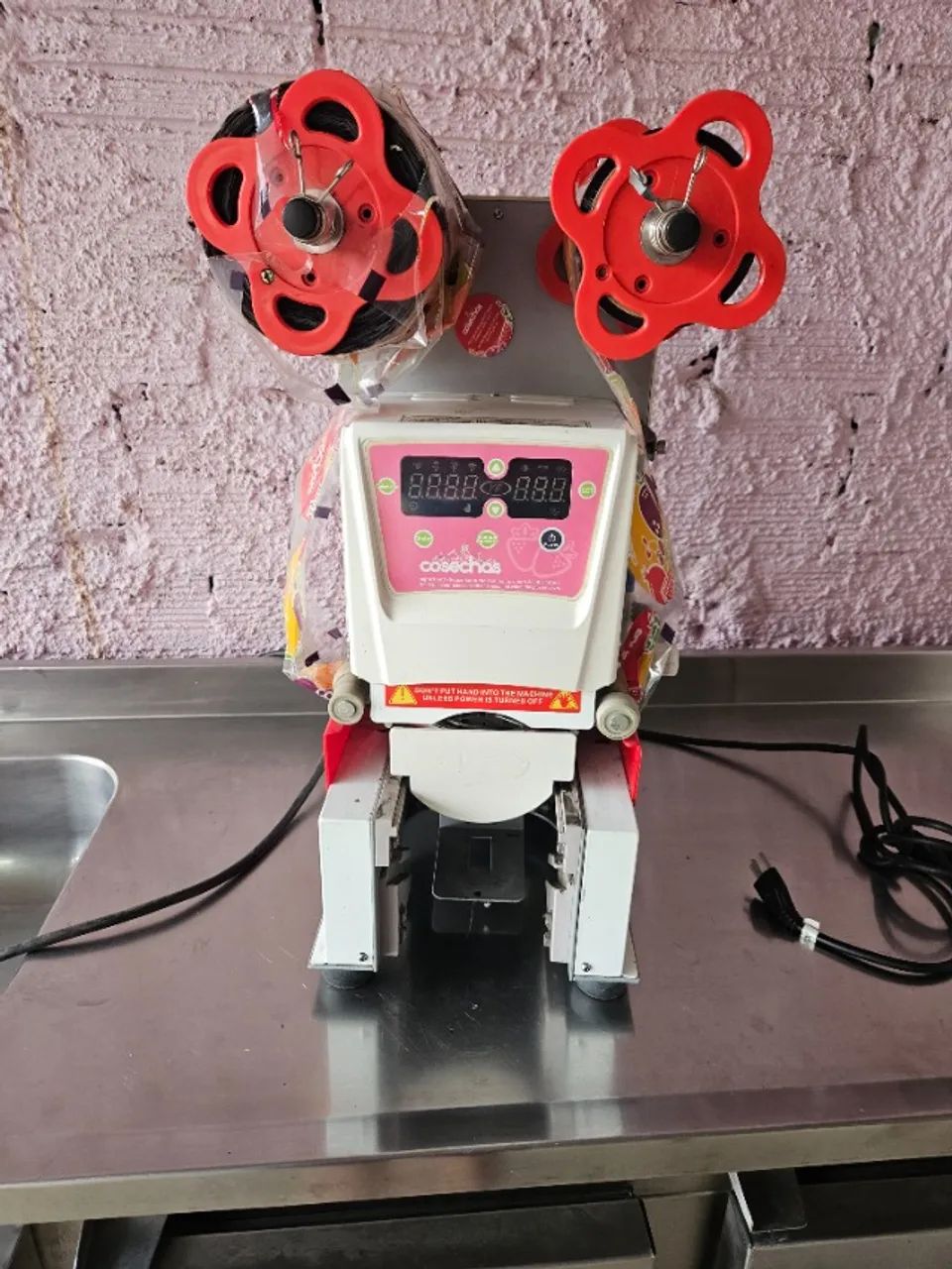 Máquina  seladora de copos