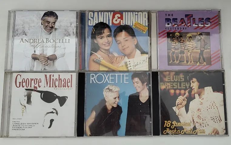 Lote c/ 5 CDs diversos Sandy e Junior Andrea Bocelli Beatles Elvis Presley George Michael