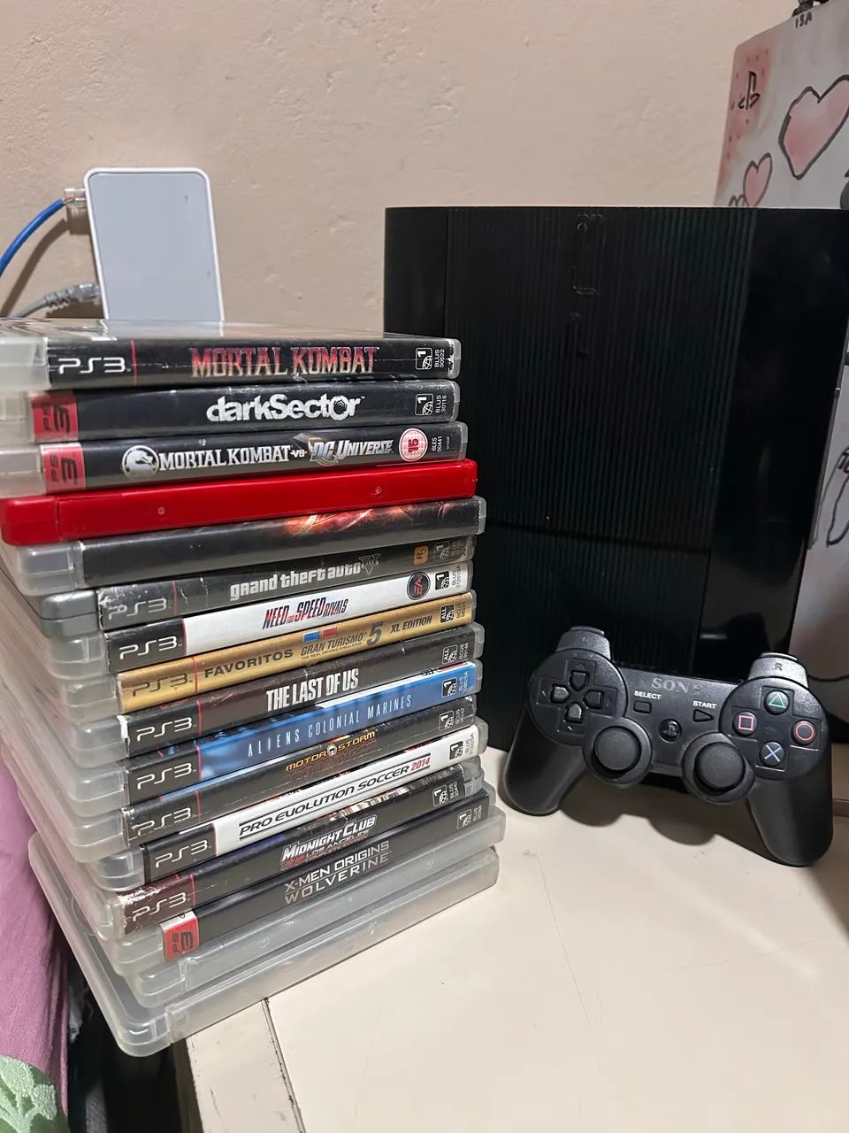 PS3 SUPER SLIM C/ 16 JOGOS MÍDIA FÍSICA COMPLETO - Jogos de Vídeo