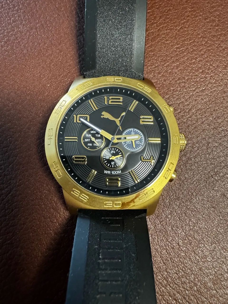 Relógio PUMA dourado