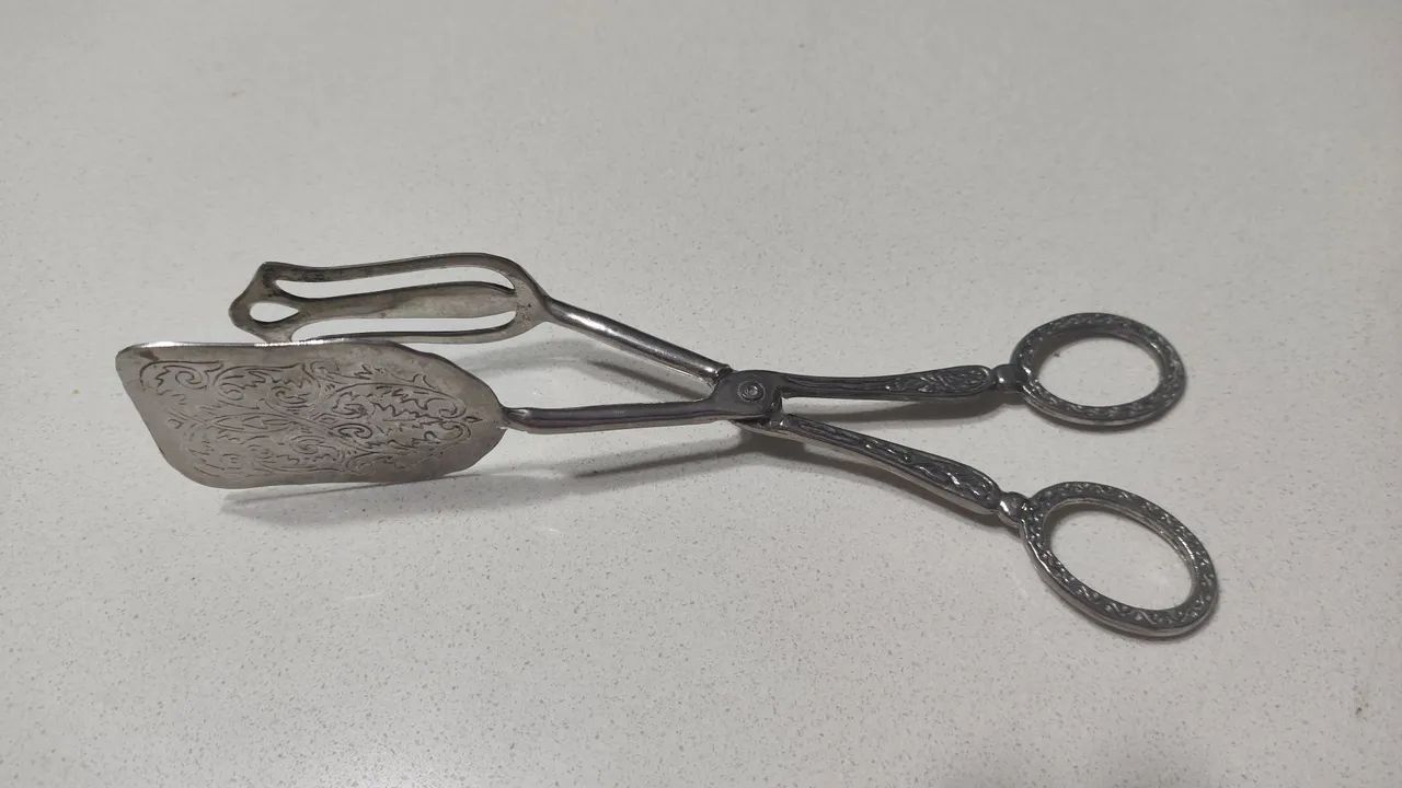Pegador de prata para antiquários 