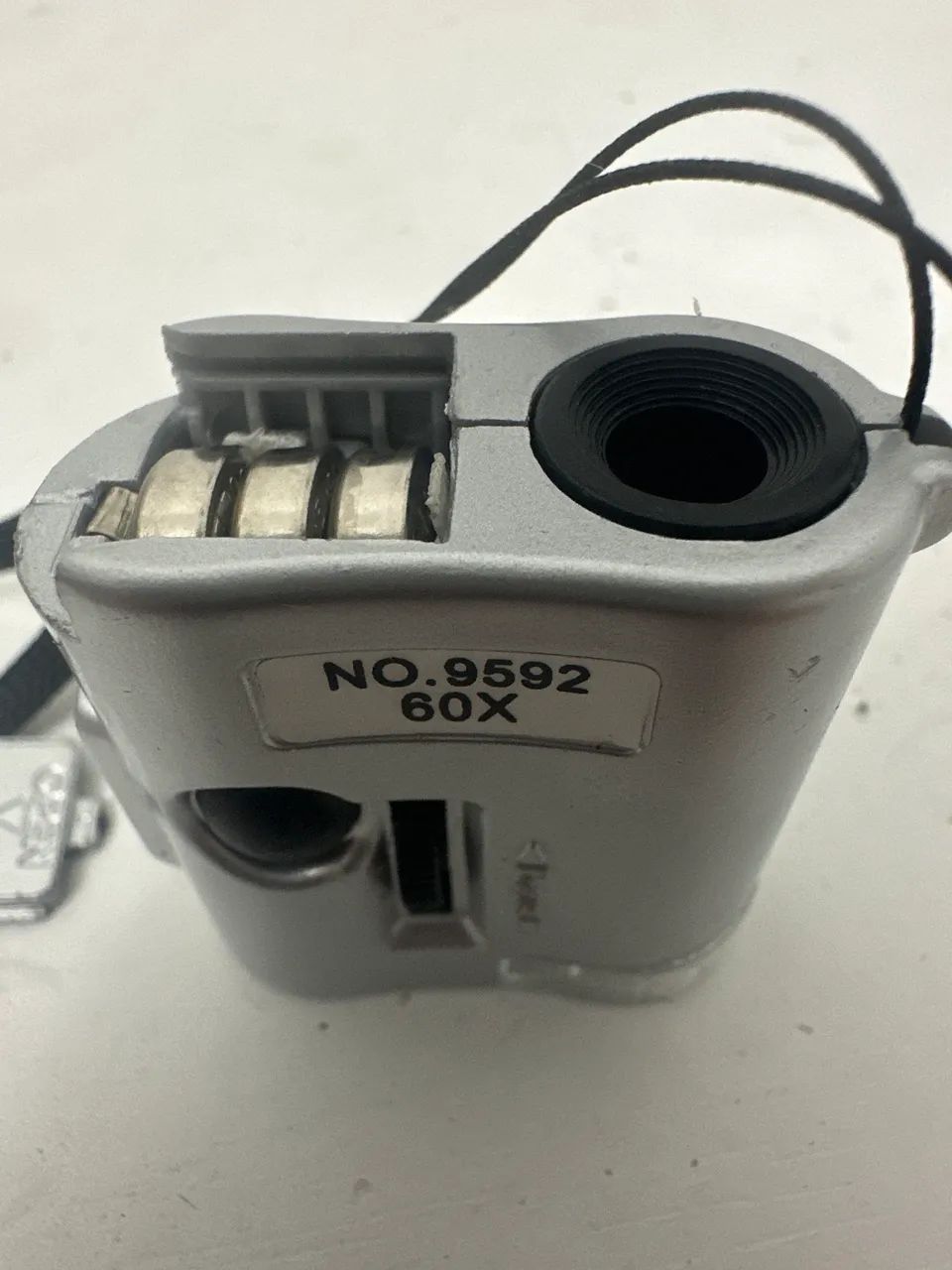 Mini microscope, up to 60x zoom. Features weak or strong LED option.