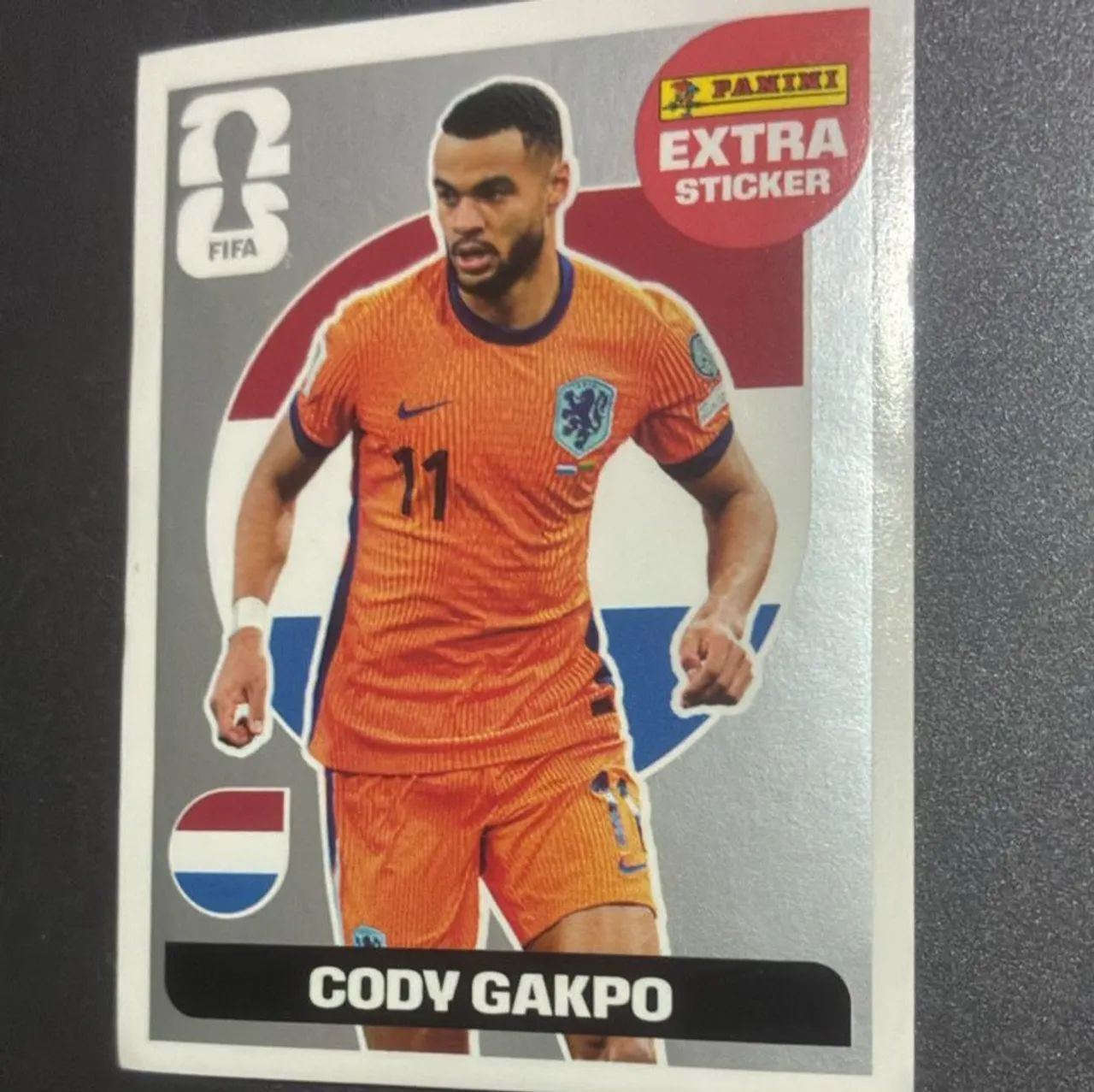 Figurinha EXTRA STICKER prateado Cody Gakpo copa do mundo 2026