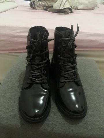 Bota em bom estado de uso