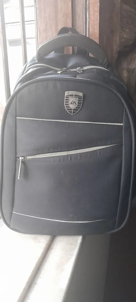 Mochila preta Huanly original.