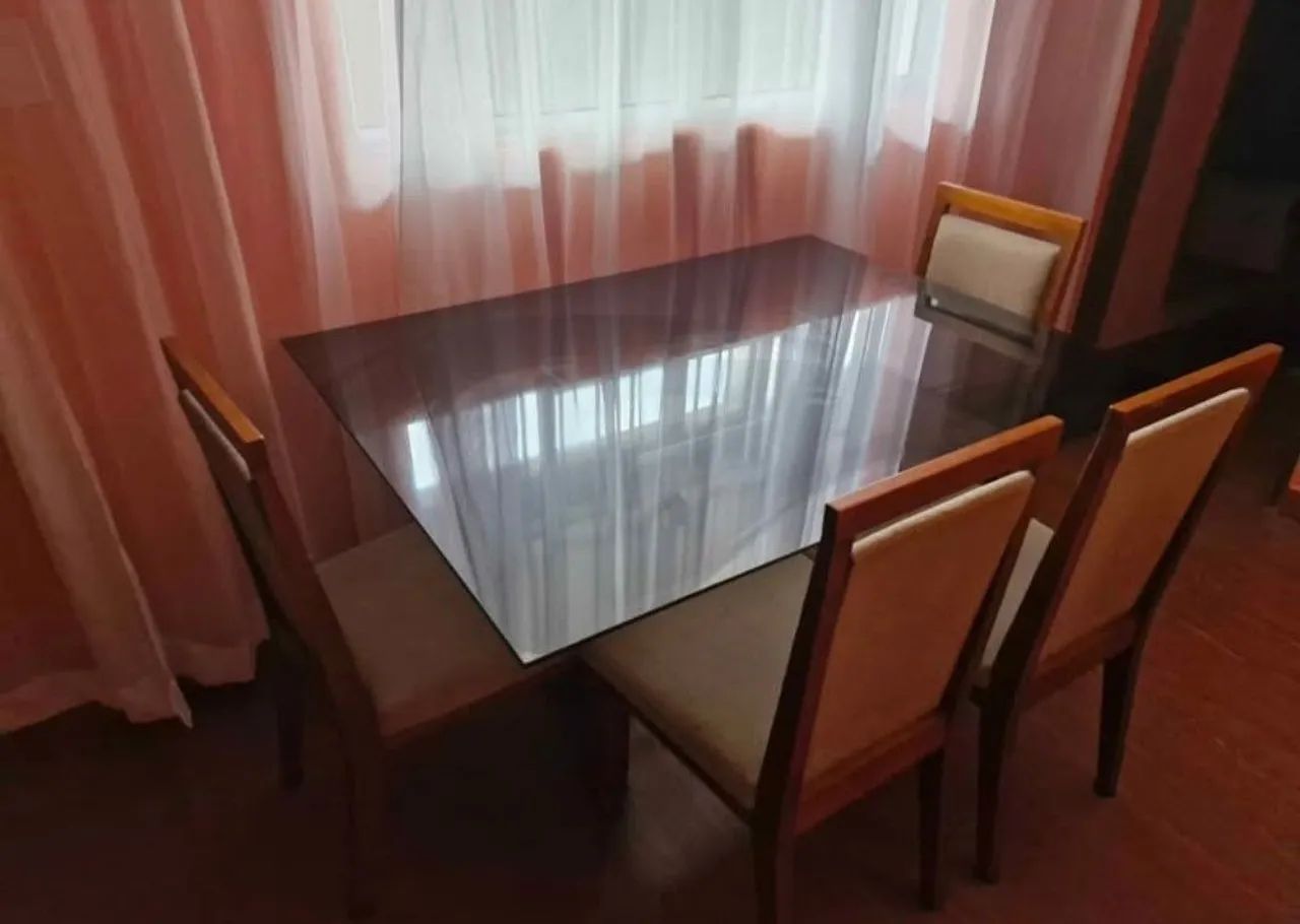 Glass dining table with four chairs