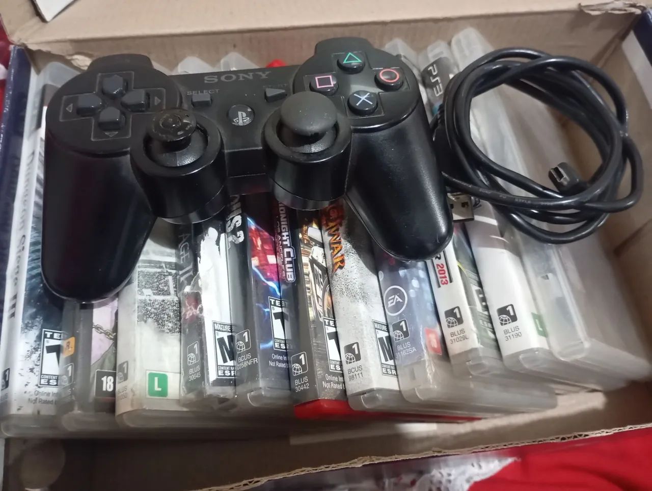 Jogos e controle de PS3 