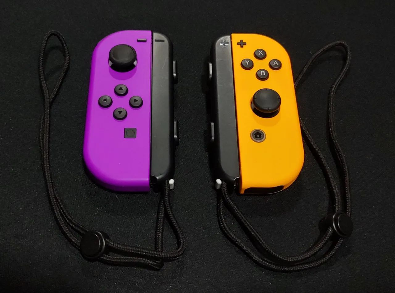 Joy Cons Originais Roxo e Laranja + straps Nintendo 