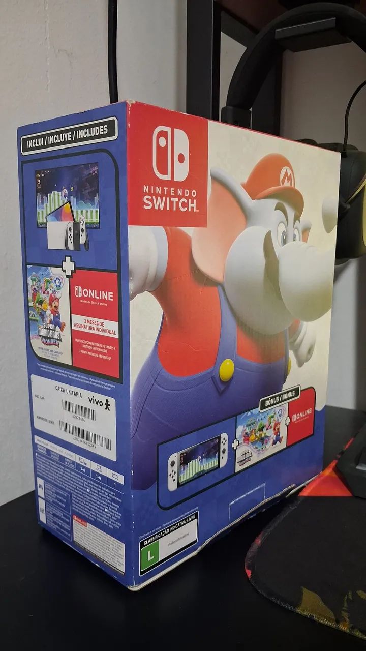 Caixa e acessórios originais de Nintendo Switch Oled Edição Mario Wonder - Foto 2