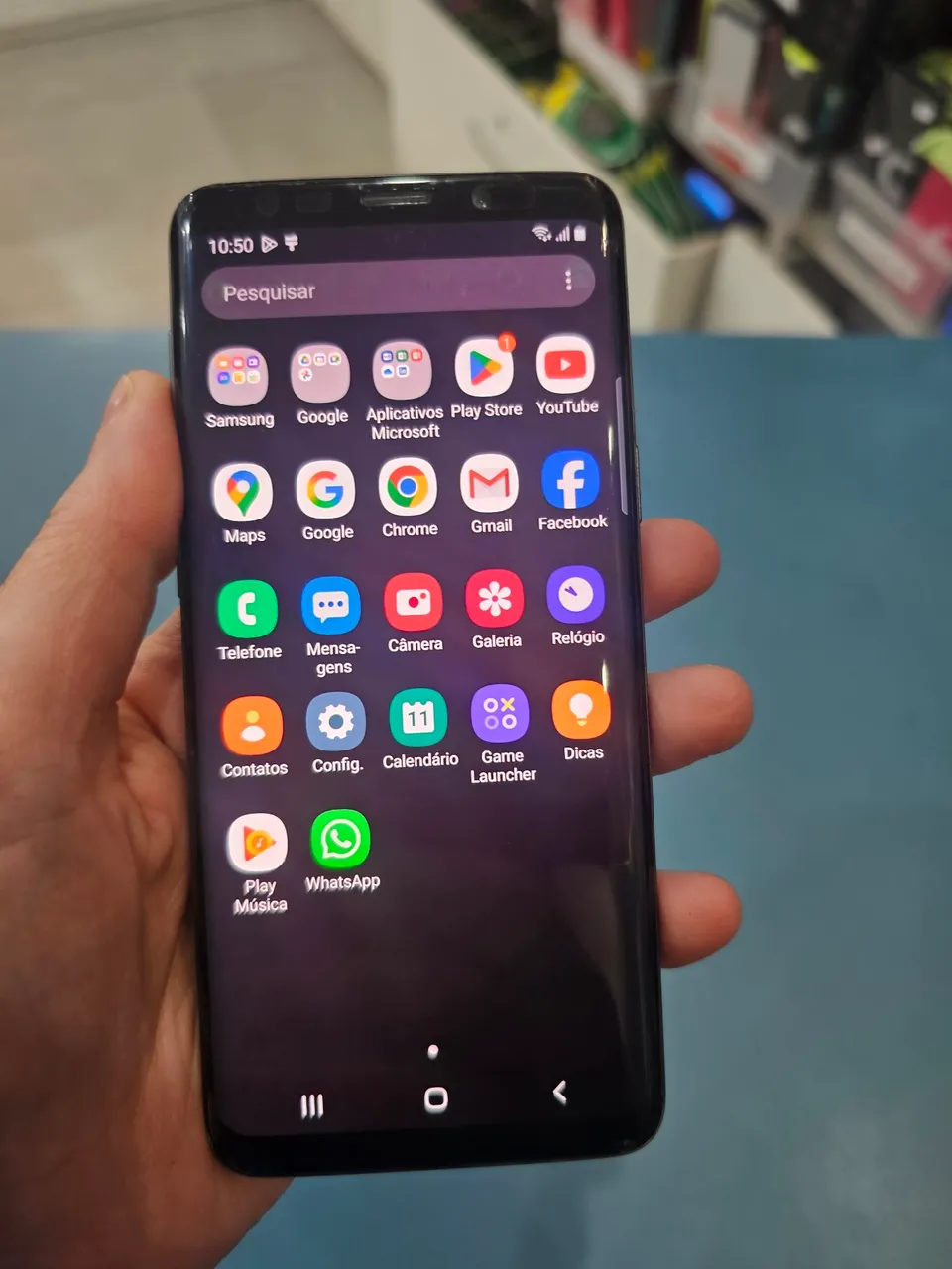 Celular S9 128Gb SemiNovo , tampa traseira com trinco onde esta adesivo em roxo.