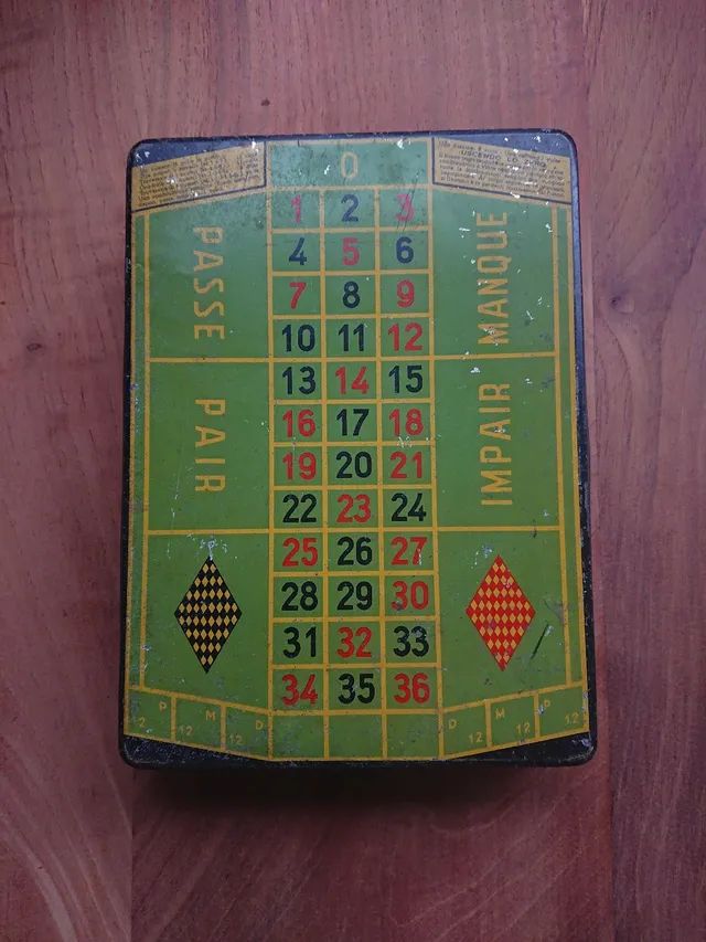 Caixa de balas Dufour com jogo de roleta 
