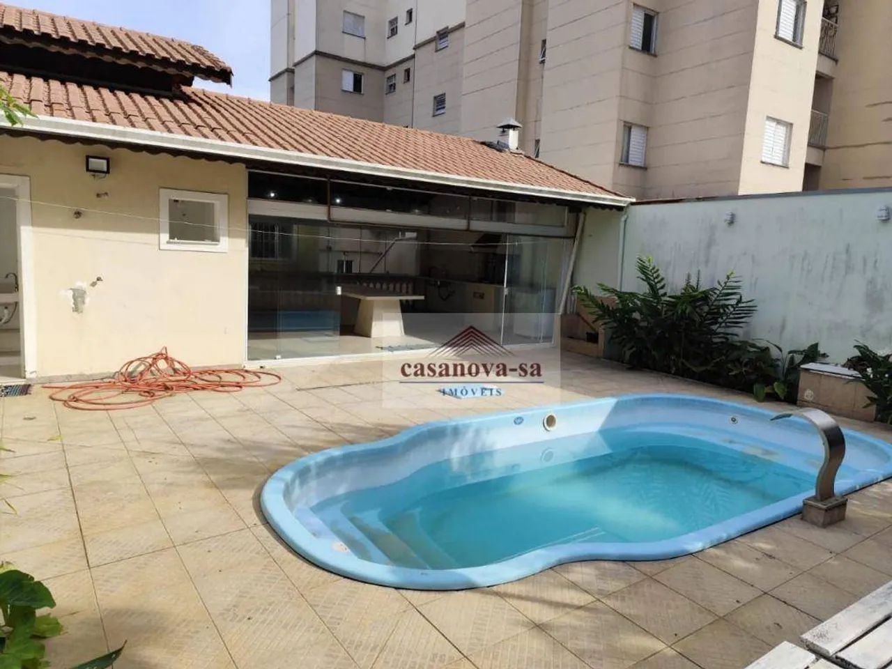 Sobrado com piscina para alugar, 424 m² por R$ 11.100/mês - Parque Bandeirante - Santo And
