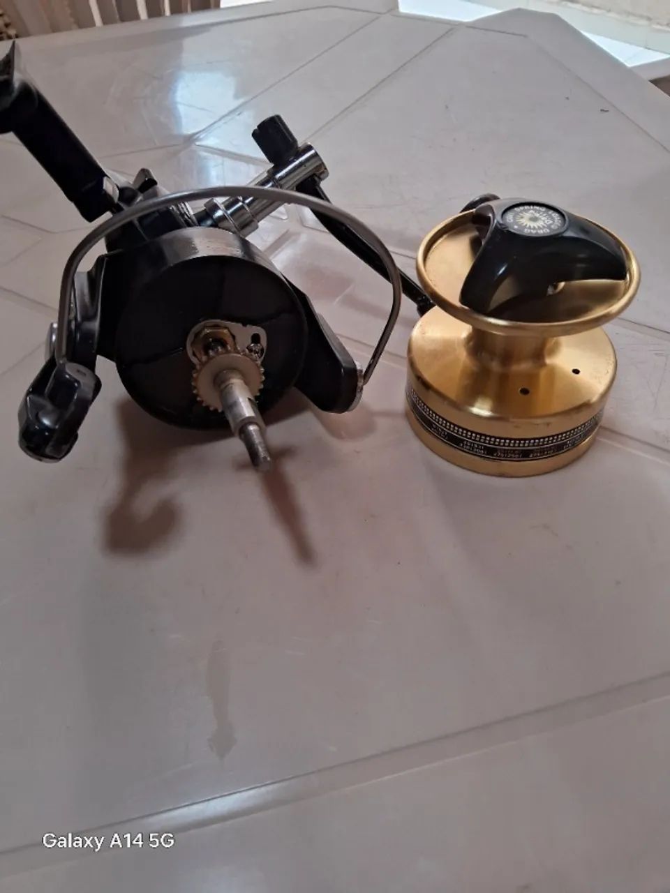 Molinete daiwa bg 90 serie ouro - Foto 2
