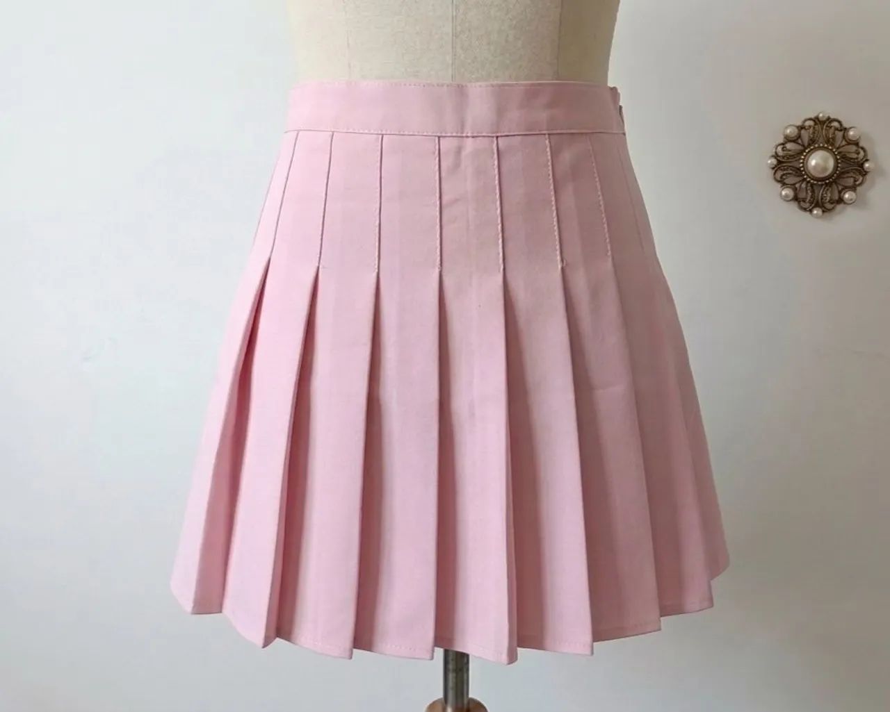 shorts saia plissada rosa cintura alta