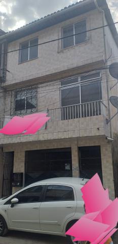 Prédio com 2 apartamentos 1 garagem