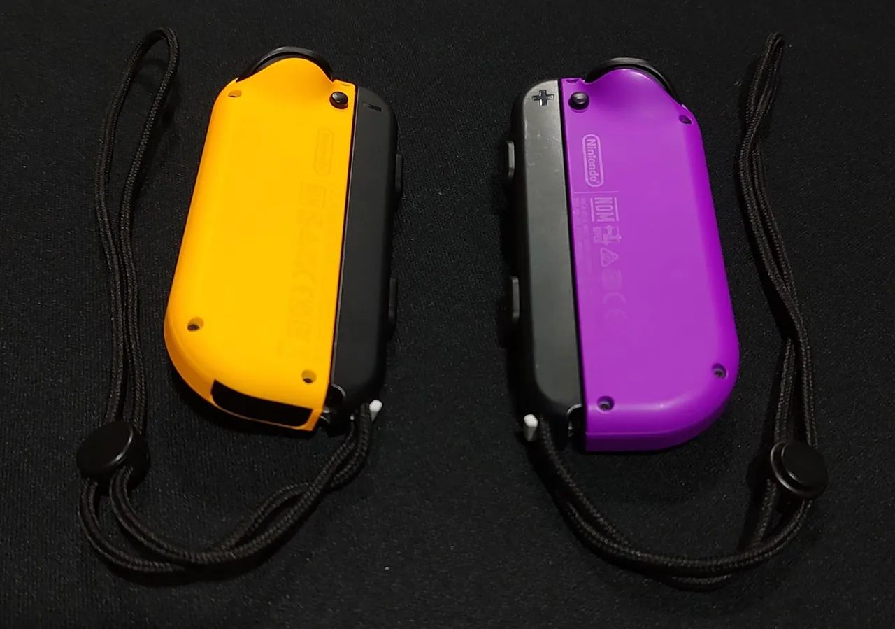 Joy Cons Originais Roxo e Laranja + straps Nintendo  - Foto 2