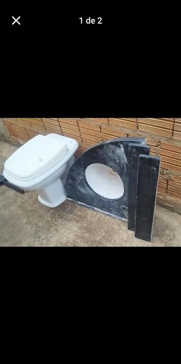 Pia com espelho de pedra e vaso