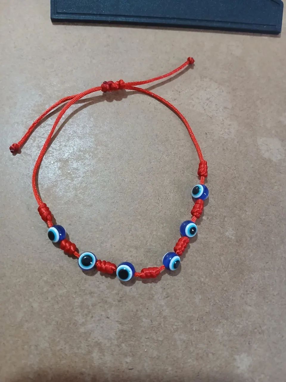 Pulseira 7 nos de olho grego 