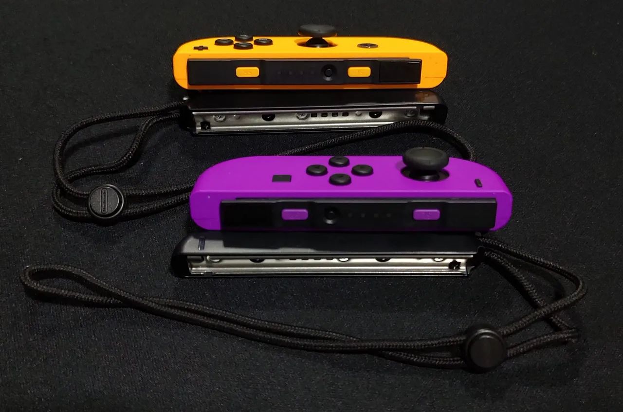 Joy Cons Originais Roxo e Laranja + straps Nintendo  - Foto 3