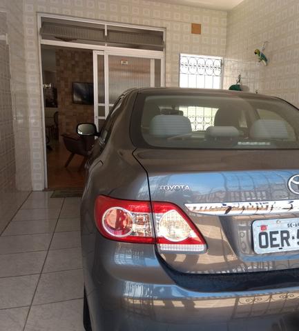 Corolla 2012/2013 Vendo ou troco em carro menor valor - Foto 5