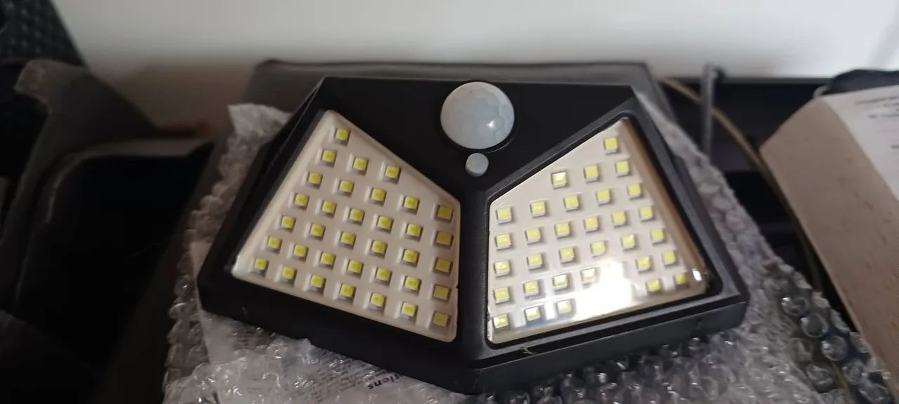 Luminária solar porta