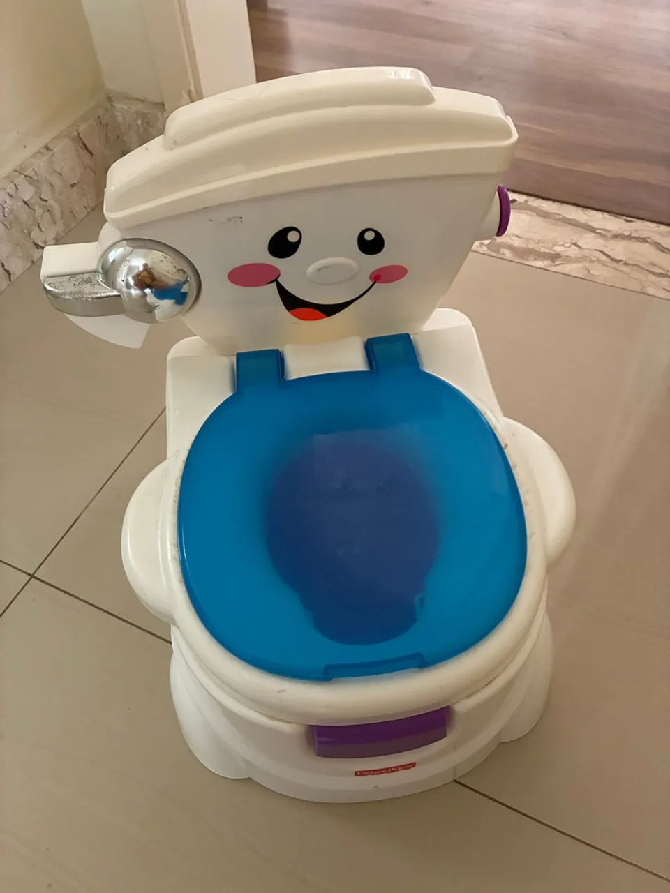 Troninho fisher price musical
